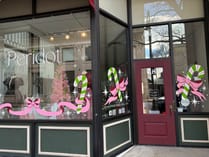 Candy canes and bows painted on the Peridot Boutique storefront