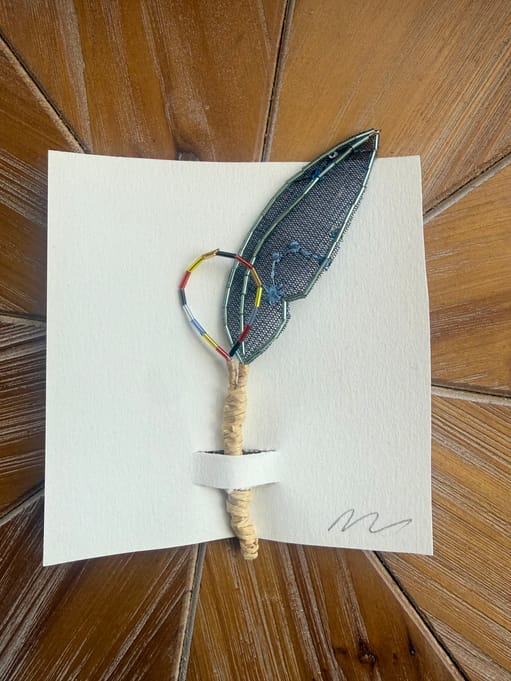 Small blue feather pick